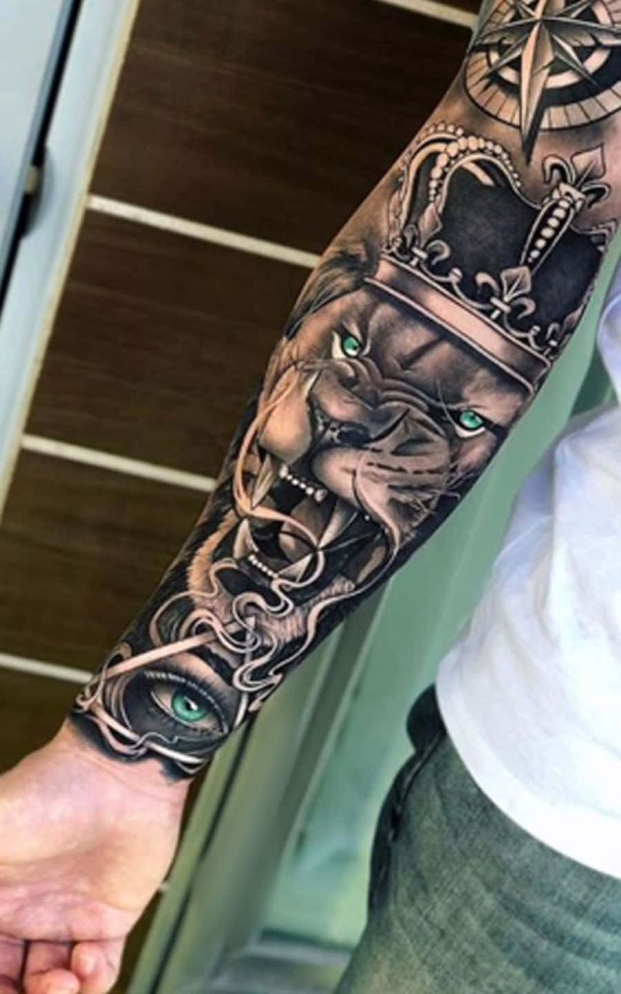 Sleeve with lion clock compass map waves colosseum tattoo idea | TattoosAI