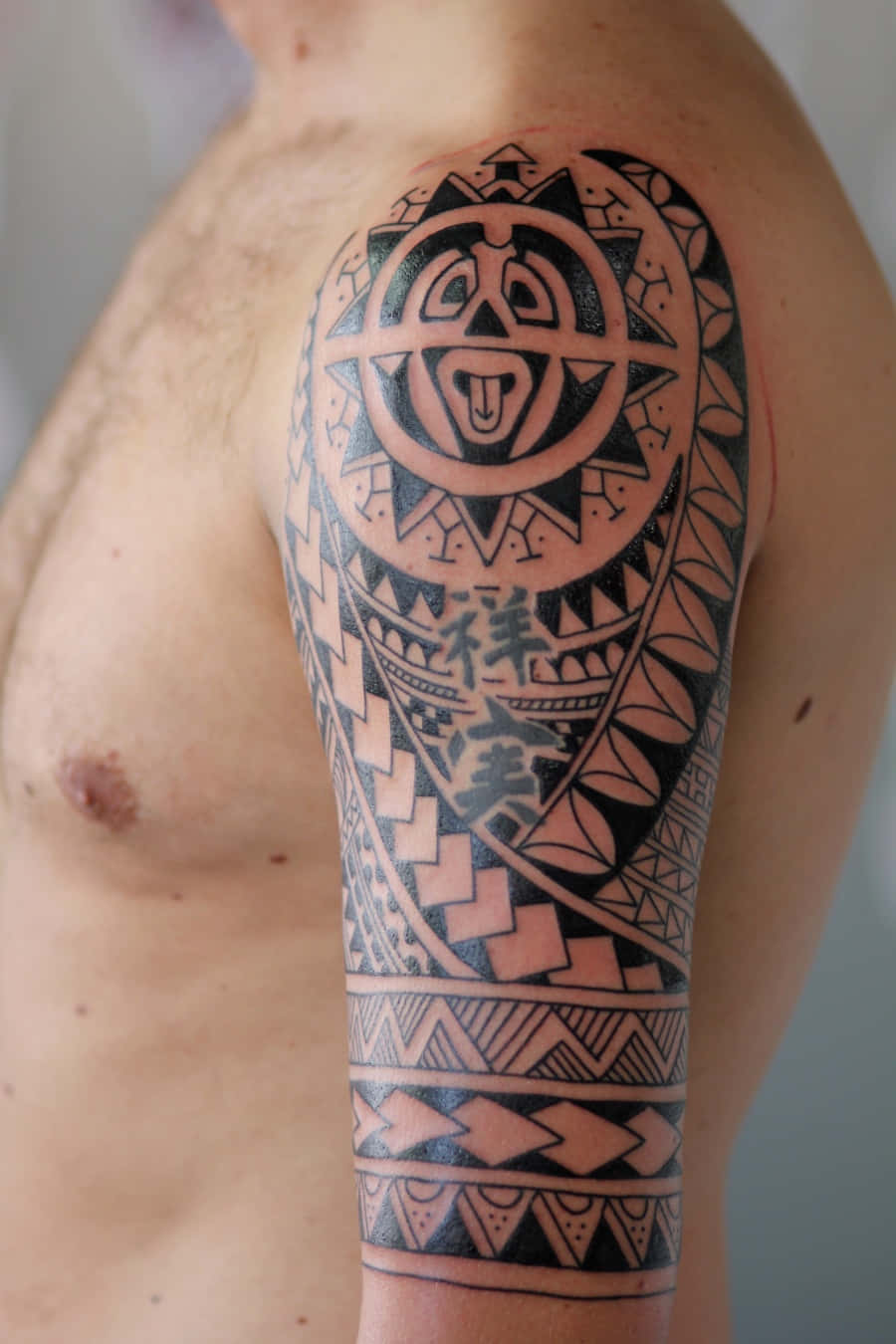 Tribal Tattoo Arm Of A Hairy Man Picture