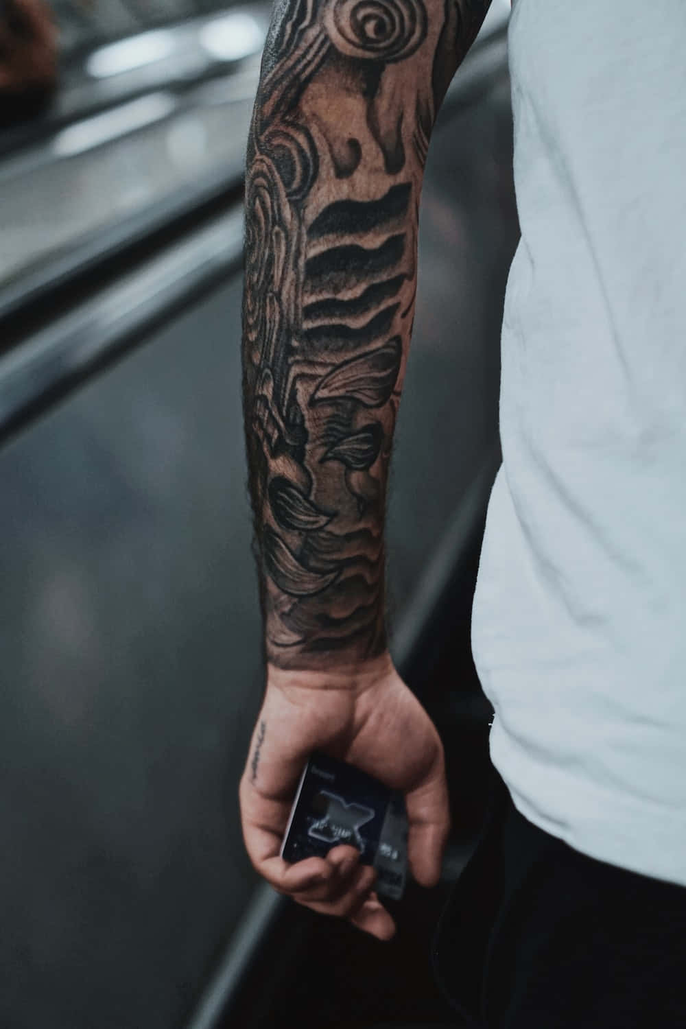 Arm Tattoo Of Man Holding Cigarette Box Picture