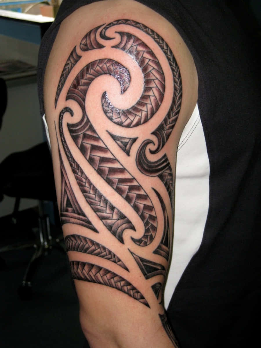 Tribal Arm Tattoo Of A Man Picture