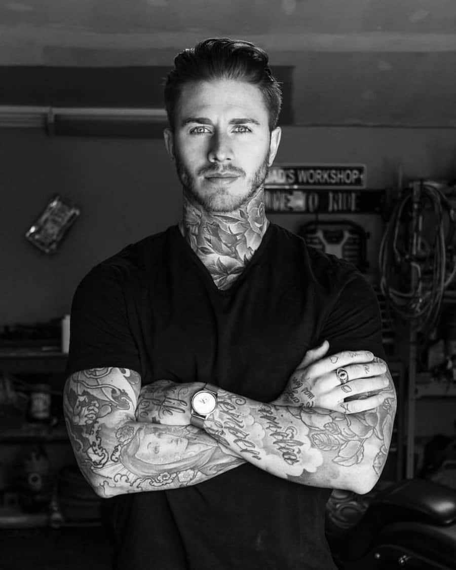 A tattooed young man looking confident and stylish