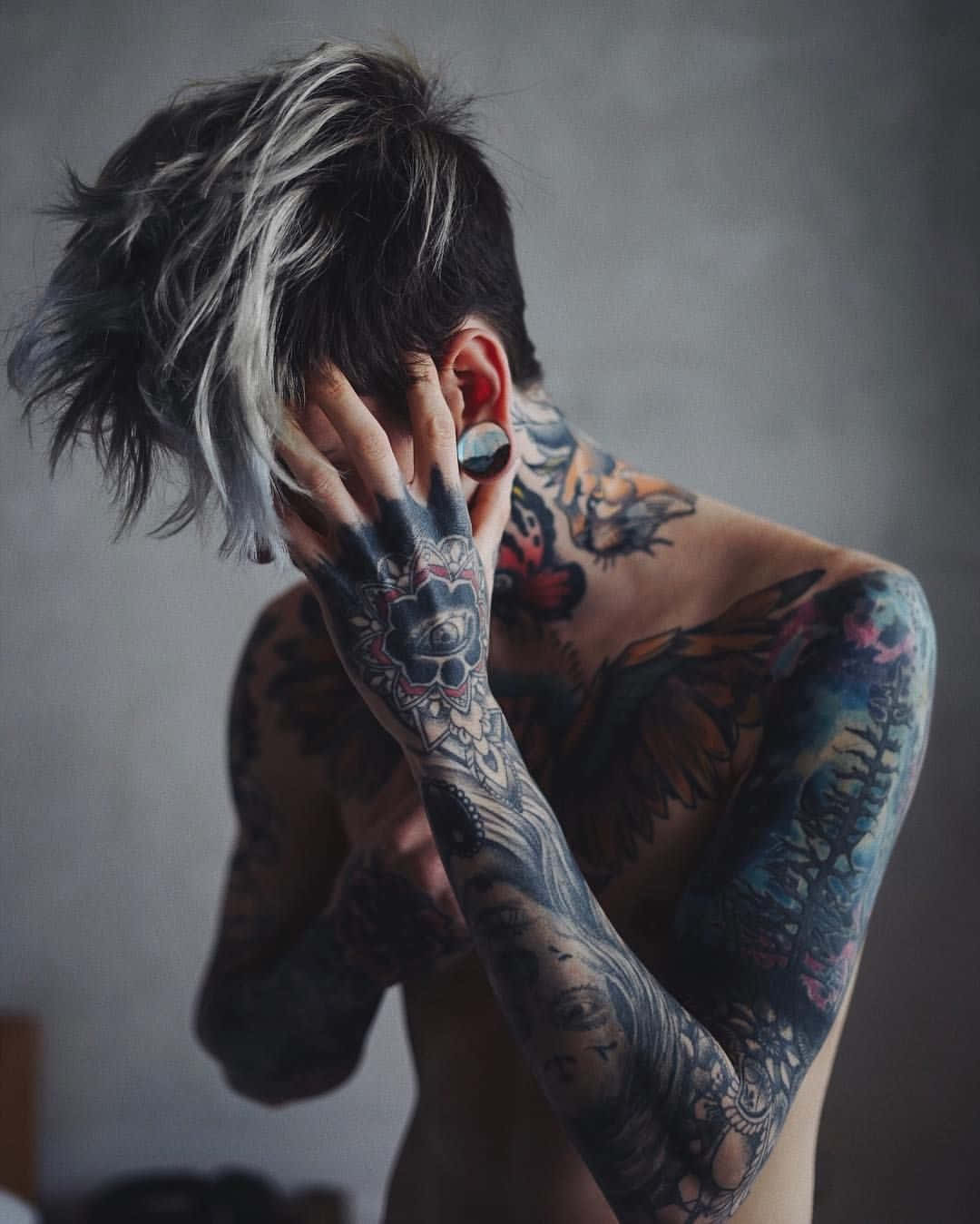 Tattooed Boy With A Smoldering Look