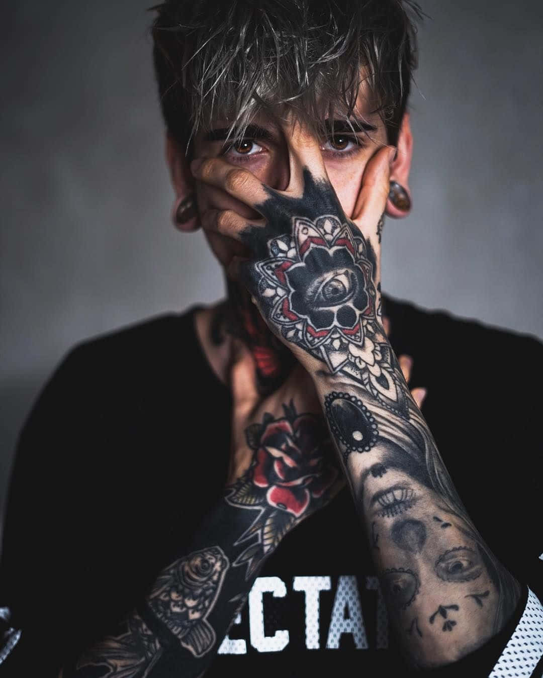 Download A Man With Tattoos Covering His Hands | Wallpapers.com
