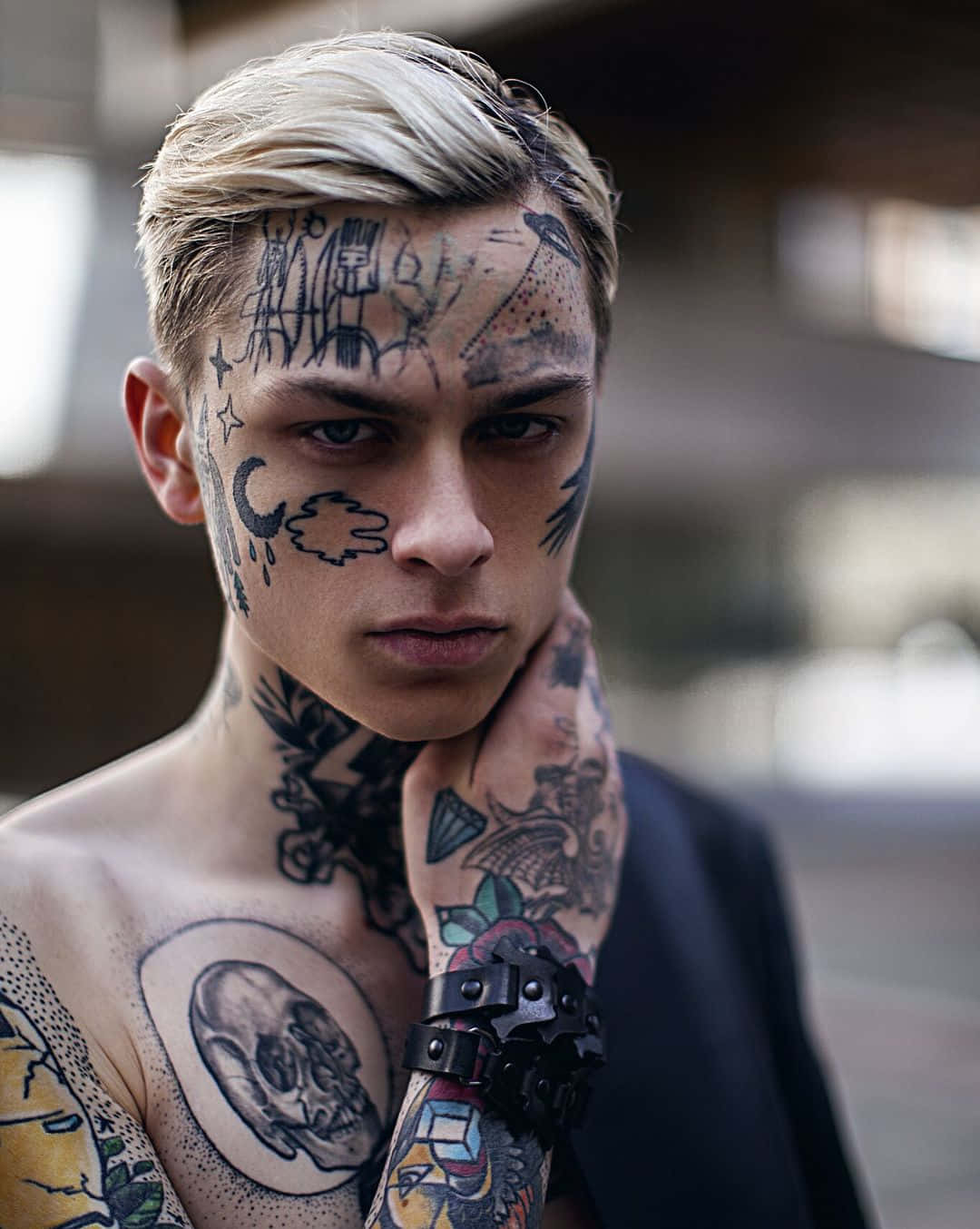 A Young Man With Tattoos On His Body