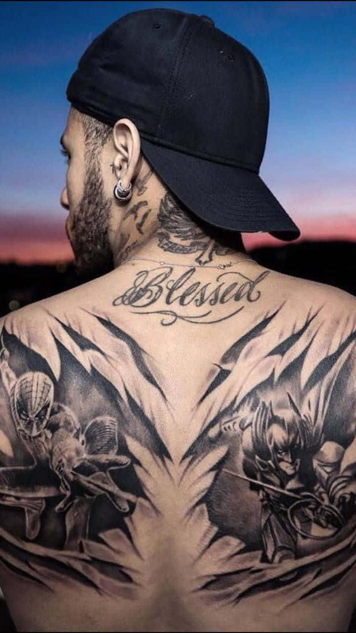 A Man With A Tattoo On His Back