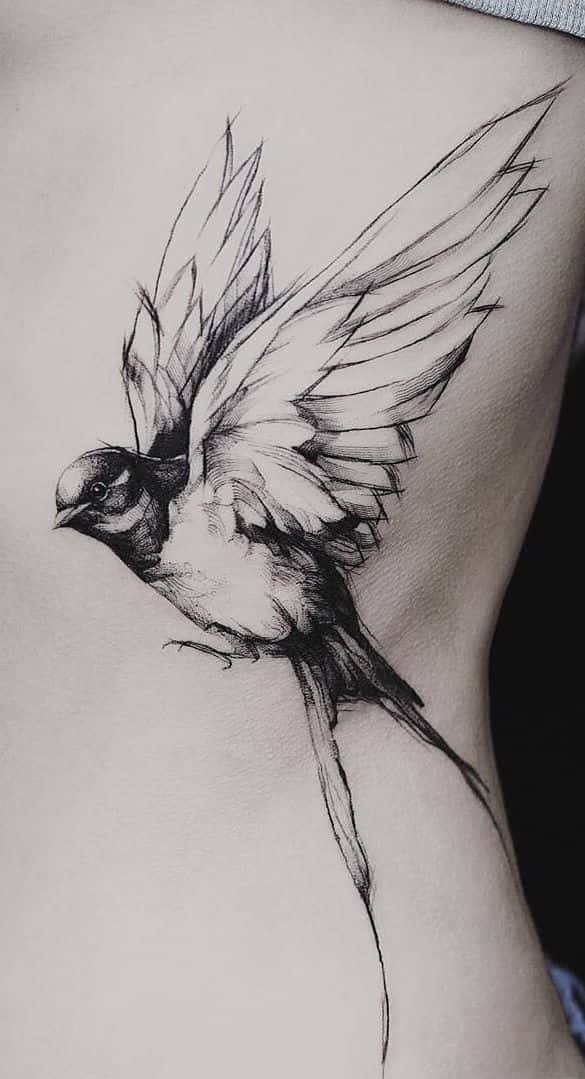 Tattoos Flying Bird In Black Ink Pictures
