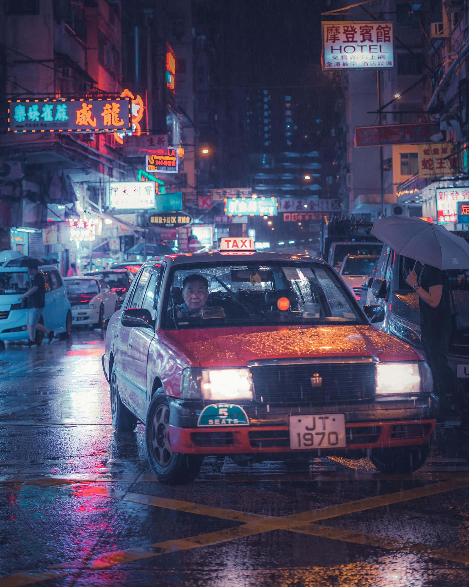 A vibrant cityscape featuring a taxi in motion
