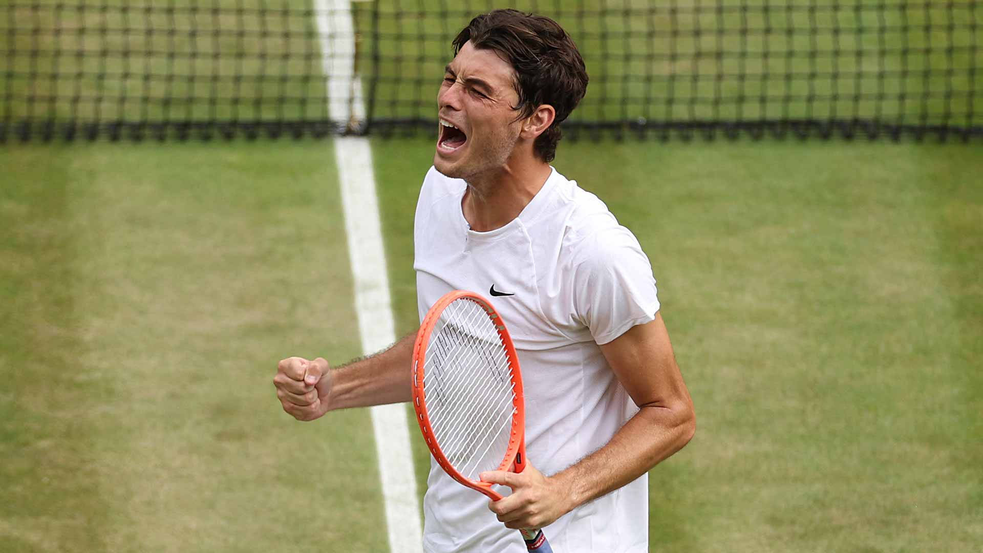 Victorious Shout - Taylor Fritz in His Moment of Triumph Wallpaper