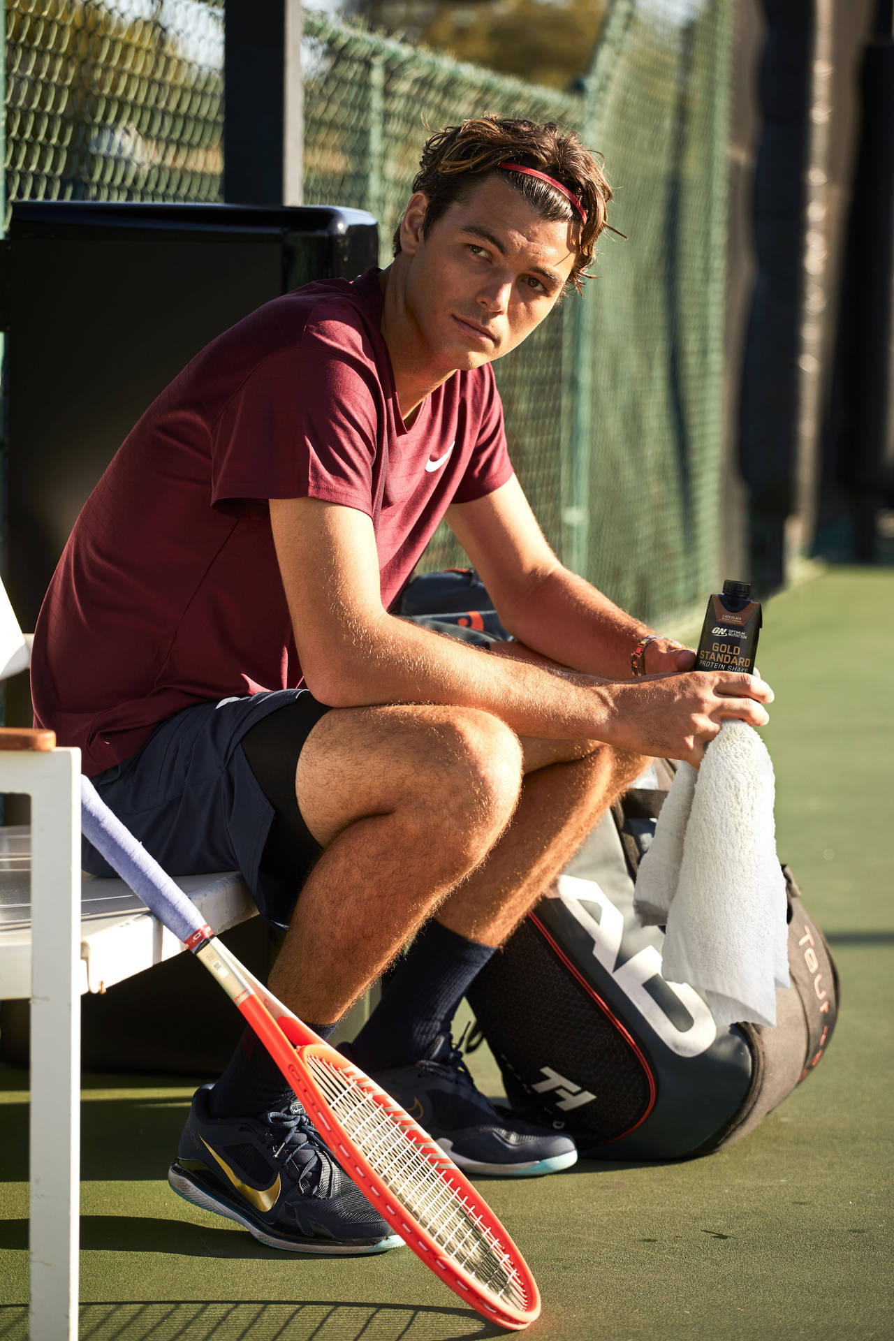 Taylor Fritz Sitting On A Bench Wallpaper