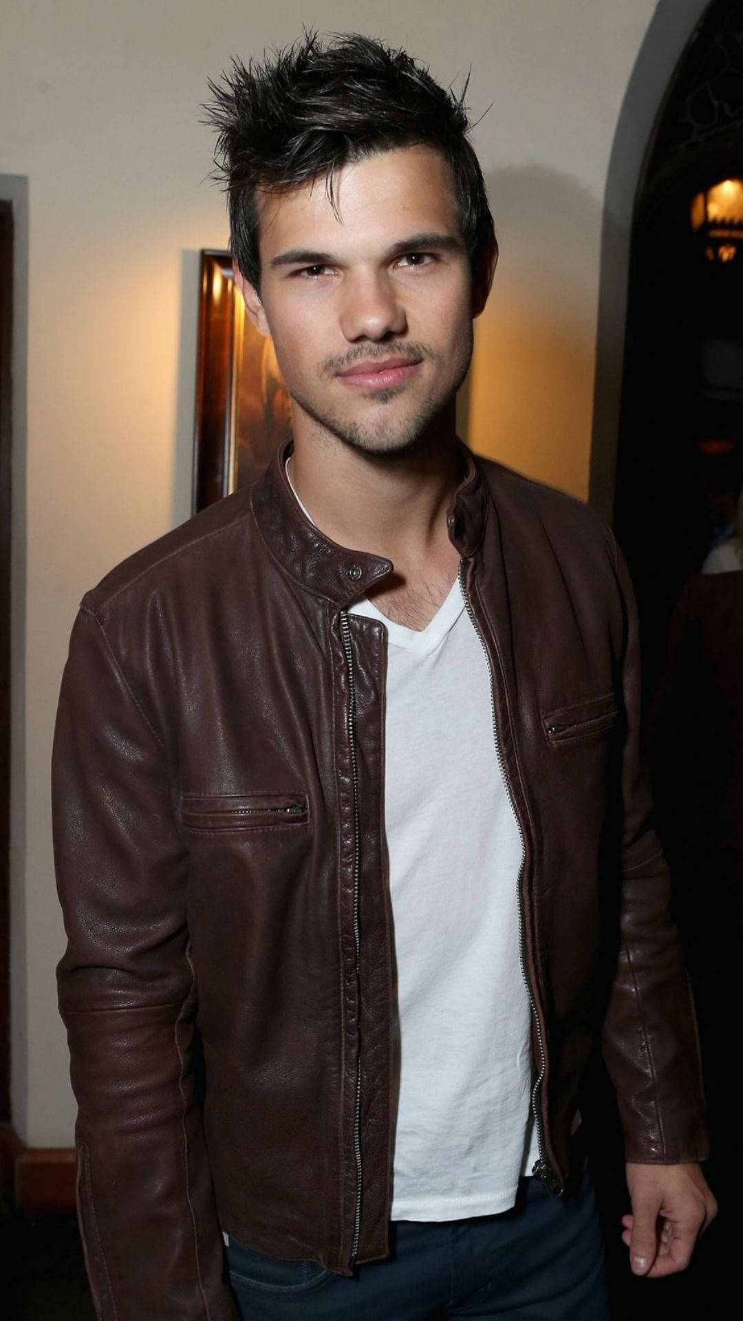 Hollywood Actor Taylor Lautner Donning a Leather Jacket Wallpaper