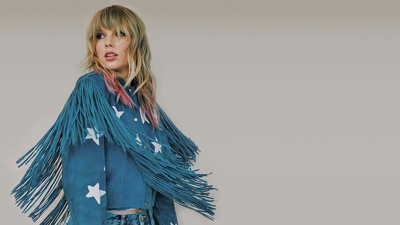 Taylor Swift Fringed Jacket Pose Wallpaper
