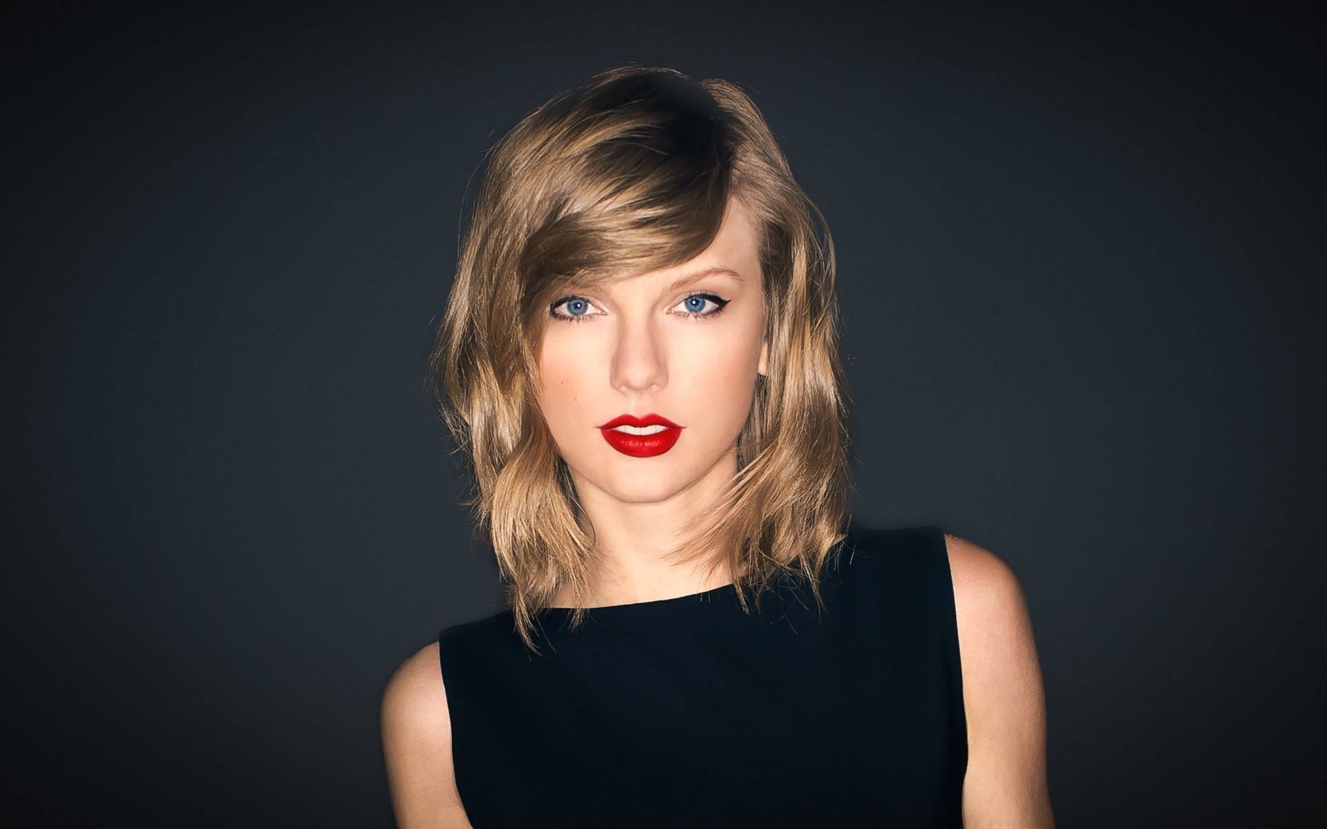 Taylor Swift Poses In Black Wallpaper