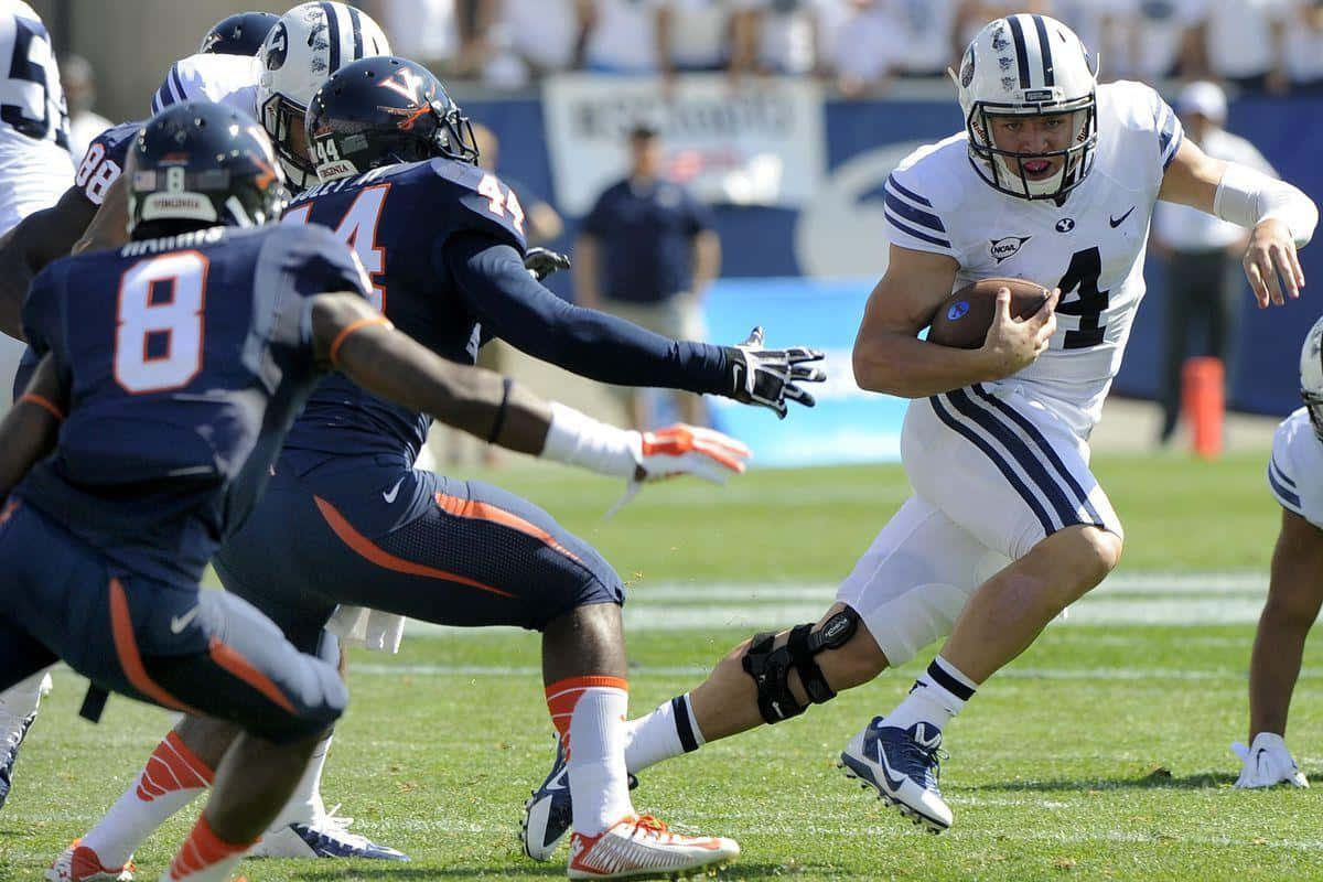 Taysom Hill College Football Action Wallpaper