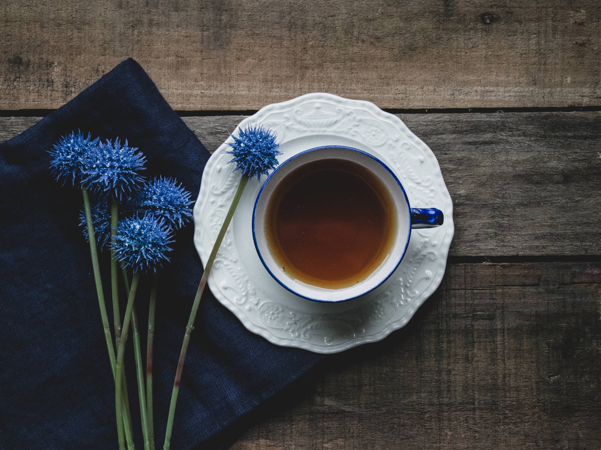 Tea And Navy Blue Flowers Background