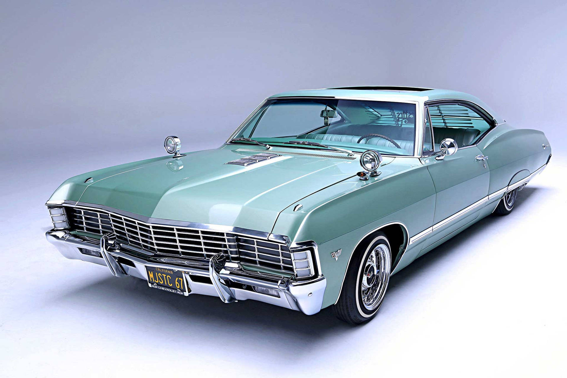 Chevroletimpala 1967 Color Verde Azulado Fondo de pantalla