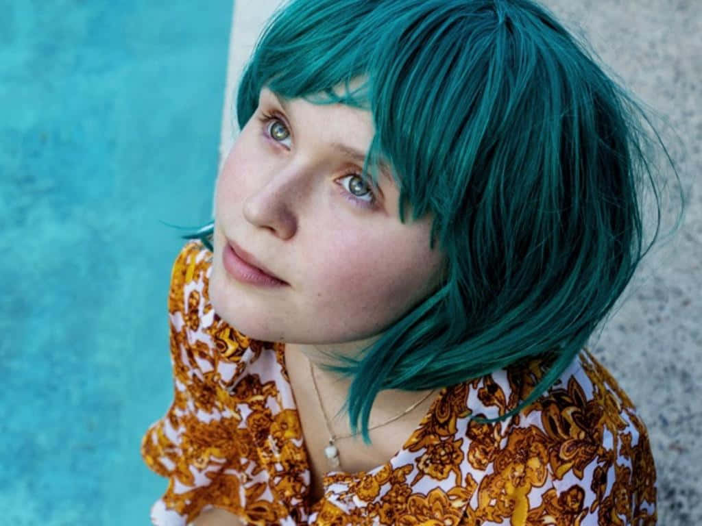 Teal Haired Woman Pensive Look Wallpaper
