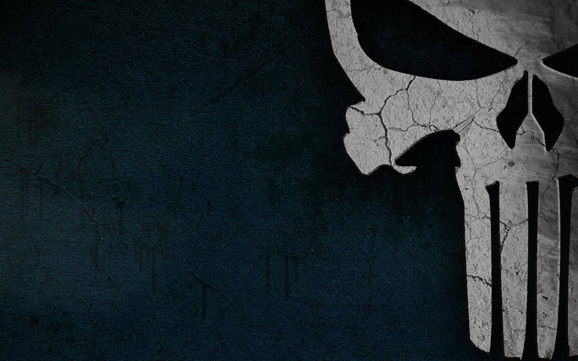 "The Punisher's iconic skull logo stands out boldly against a teal background" Wallpaper