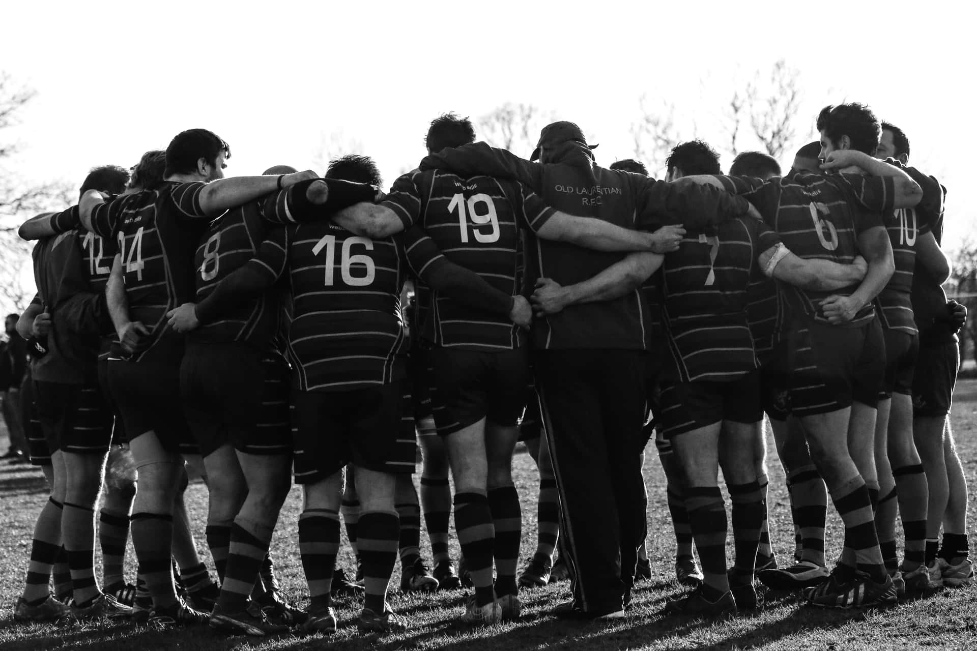 Rugby Players Huddle In A Circle