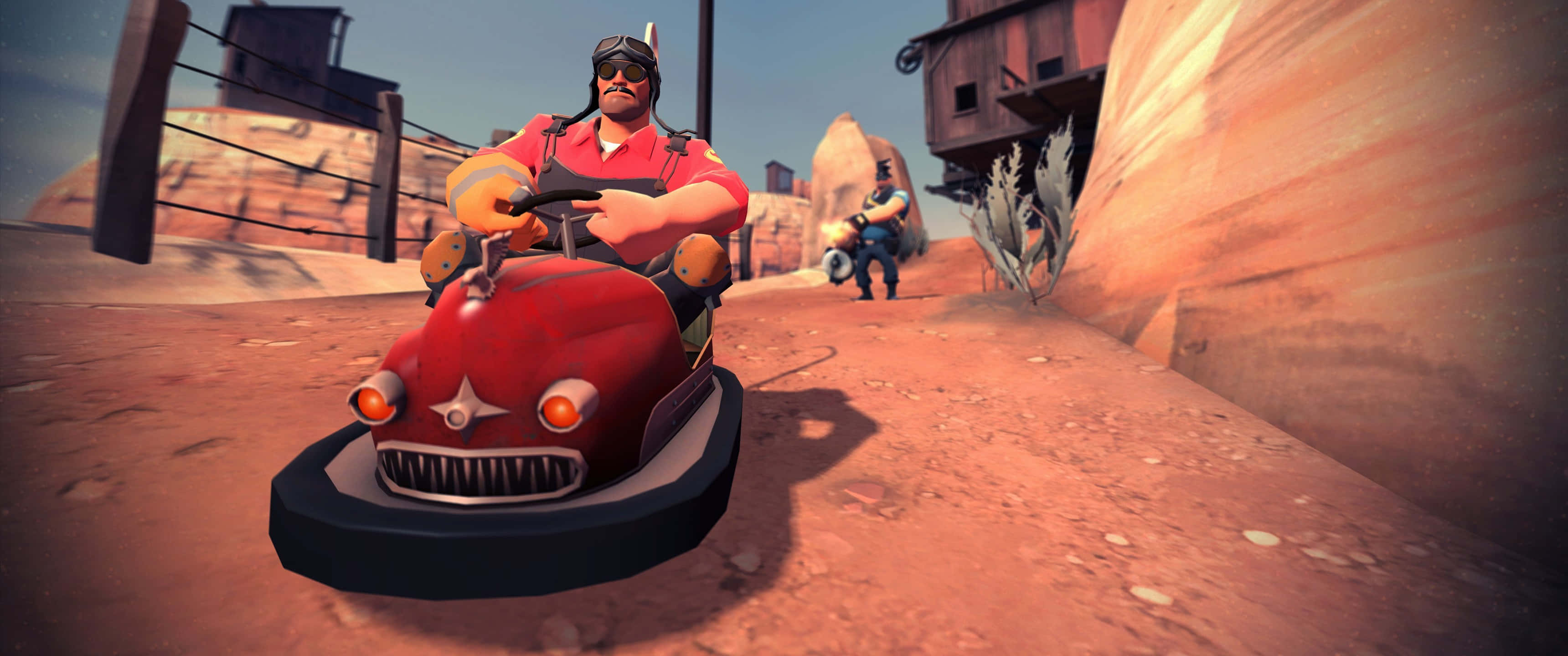 A Man Is Driving A Red Car In A Desert