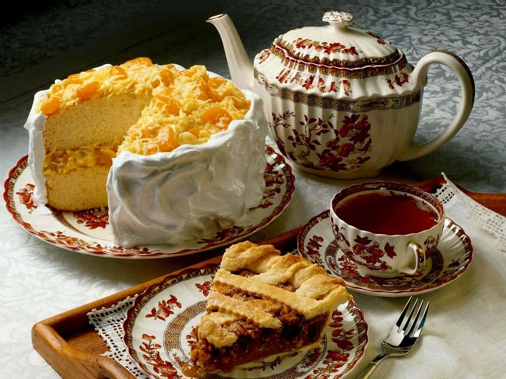 A Tray With A Cake And Tea