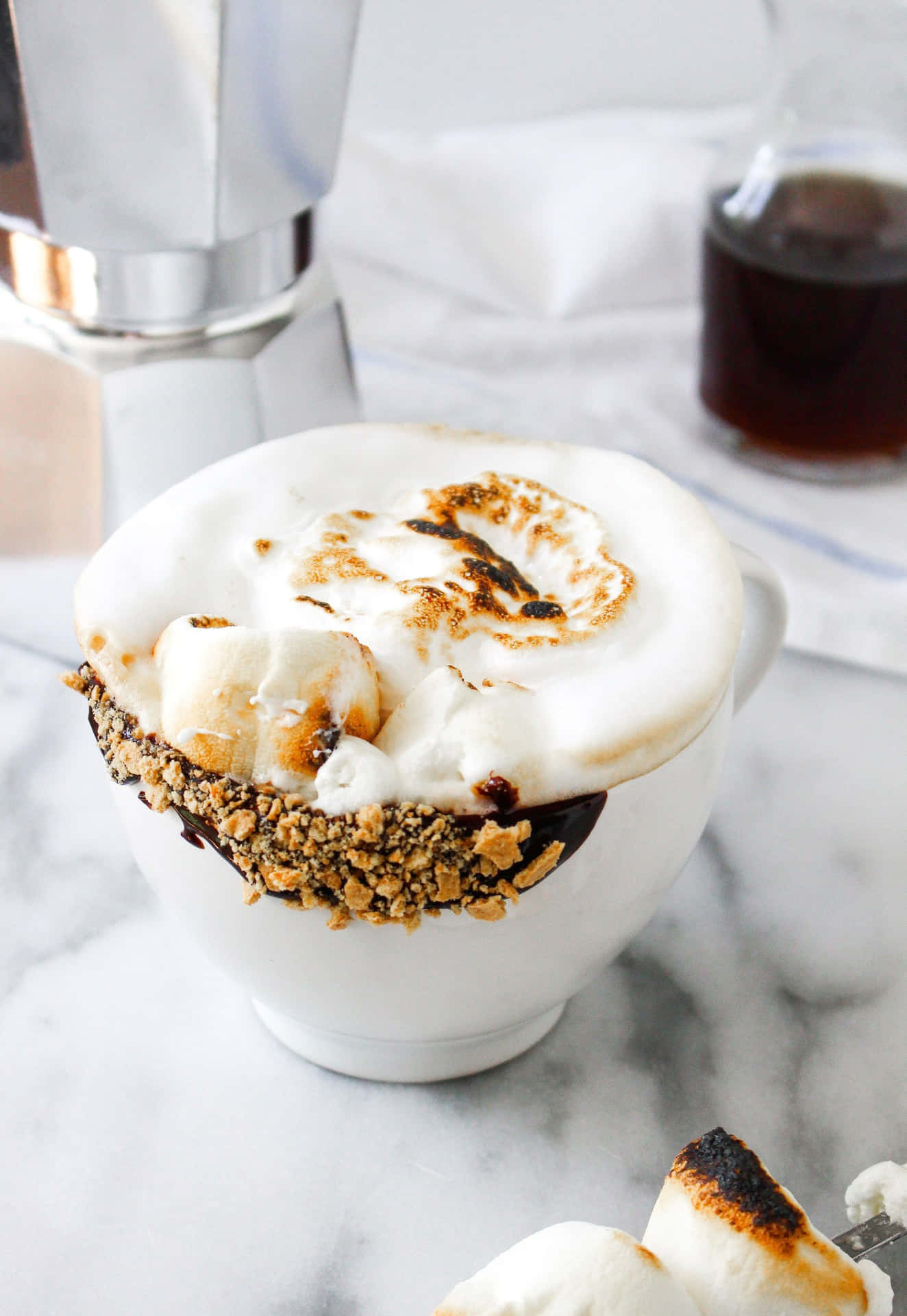 A Cup Of Coffee With A Smore On Top