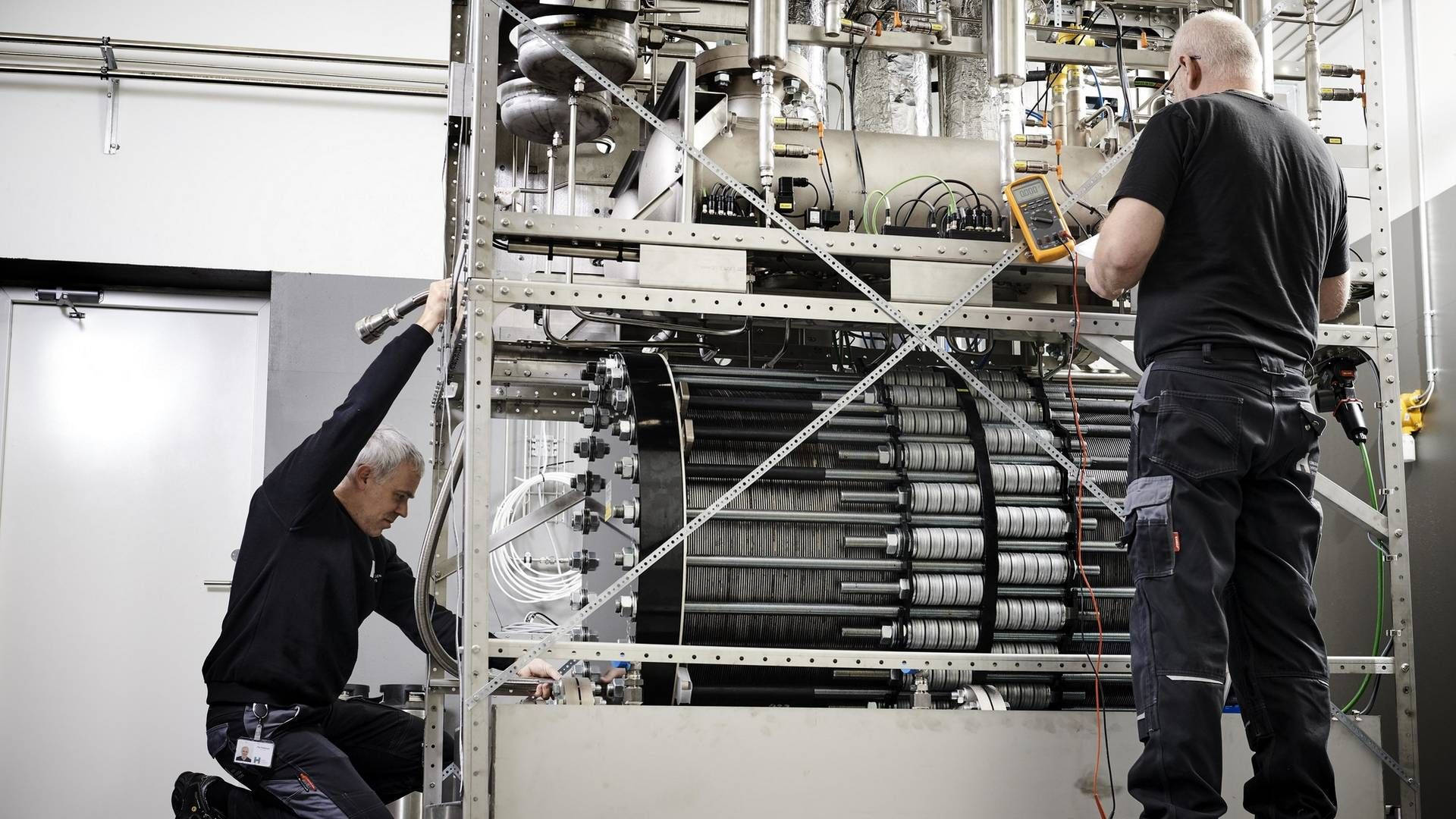 Technician Creating Hydrogen-Powered Generators Wallpaper