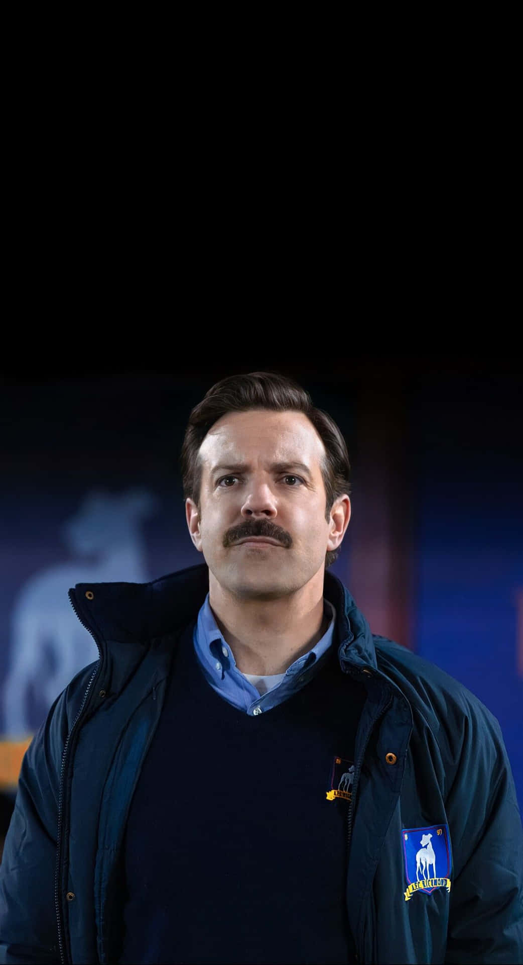 Ted Lasso Character Stadium Background Wallpaper