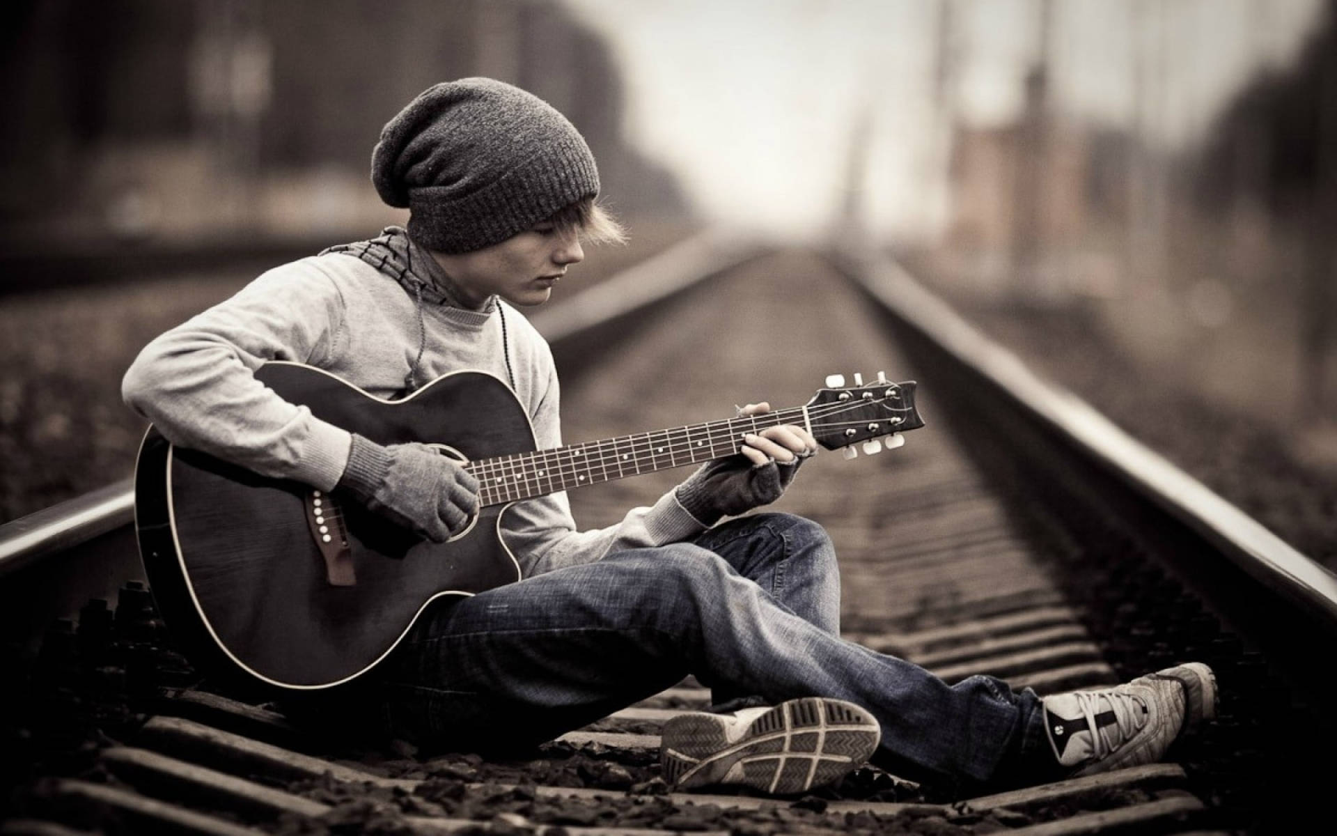 Teenage Boy Alone In Railway Background