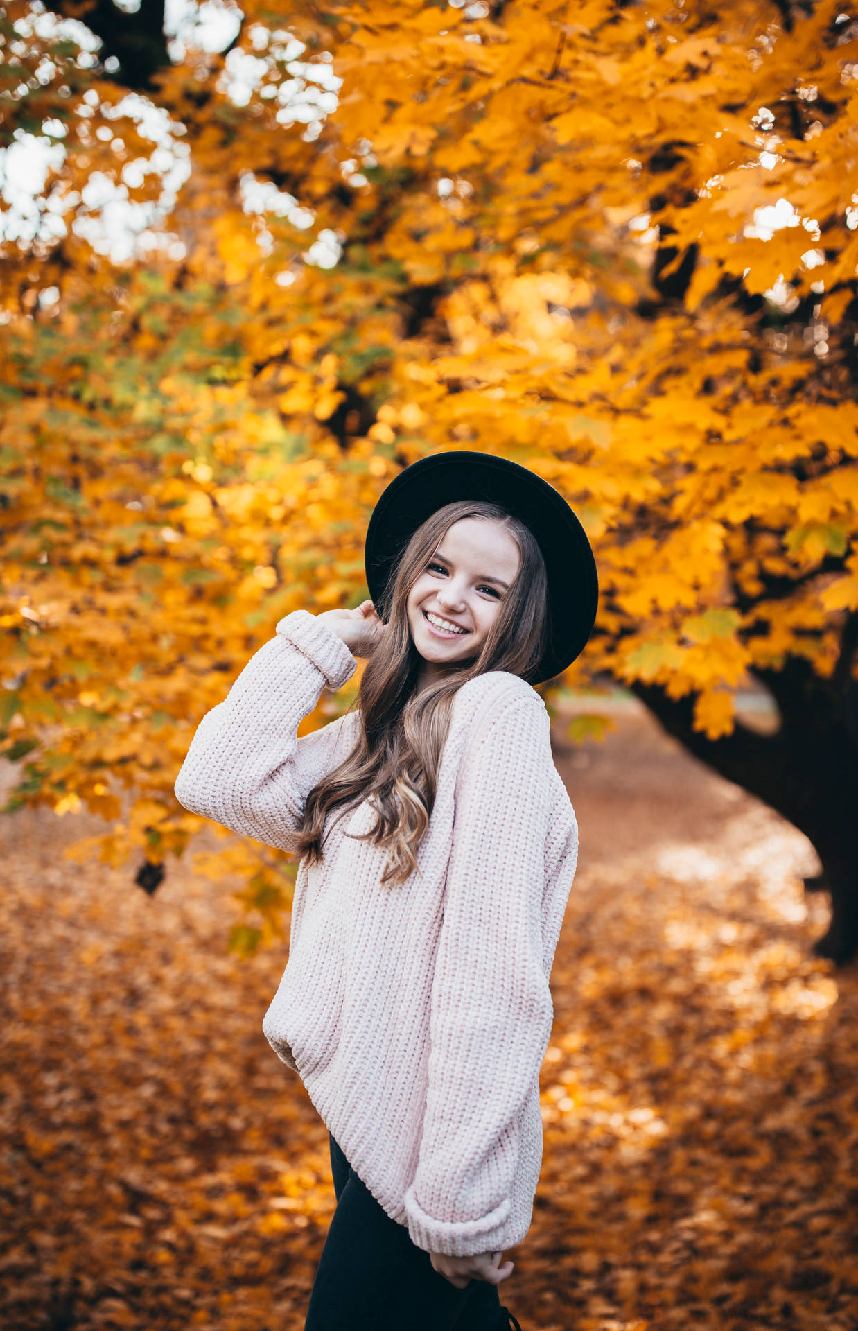 Teenage Girl By Autumn Tree Wallpaper
