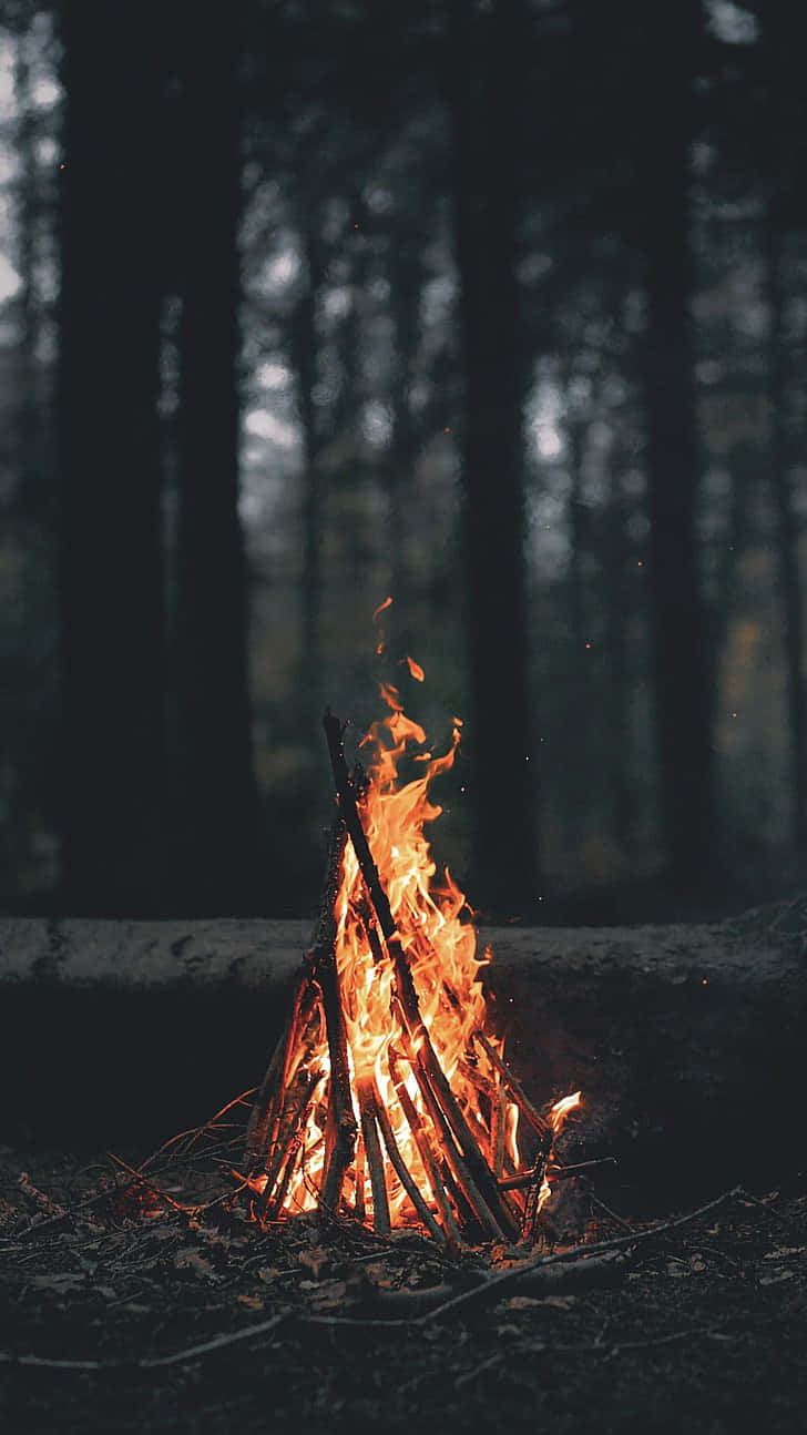 Teepee Burning Campfire Wallpaper
