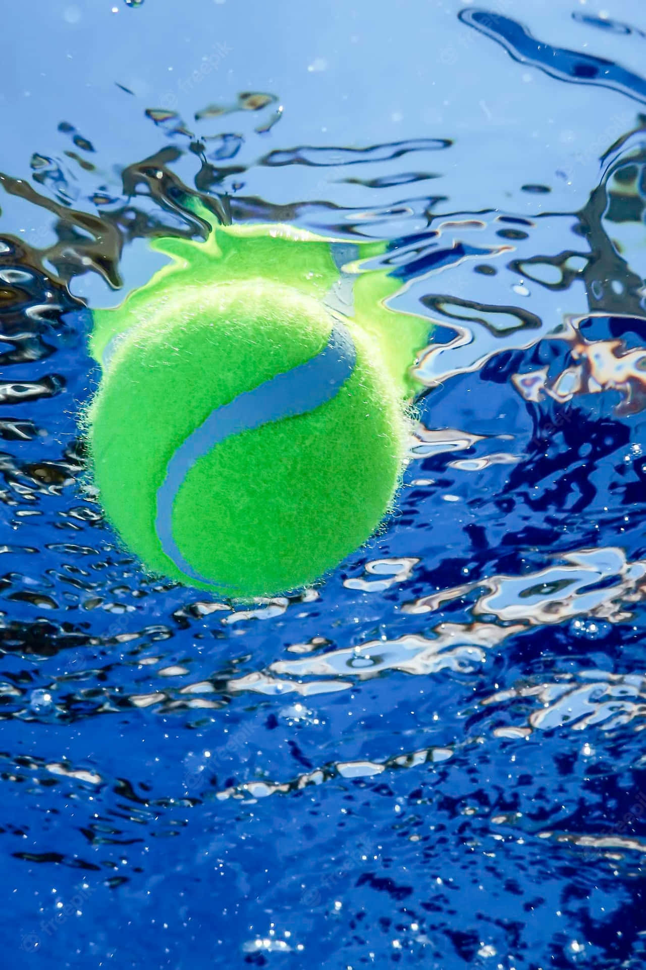 A Tennis Ball Floating In The Water Wallpaper