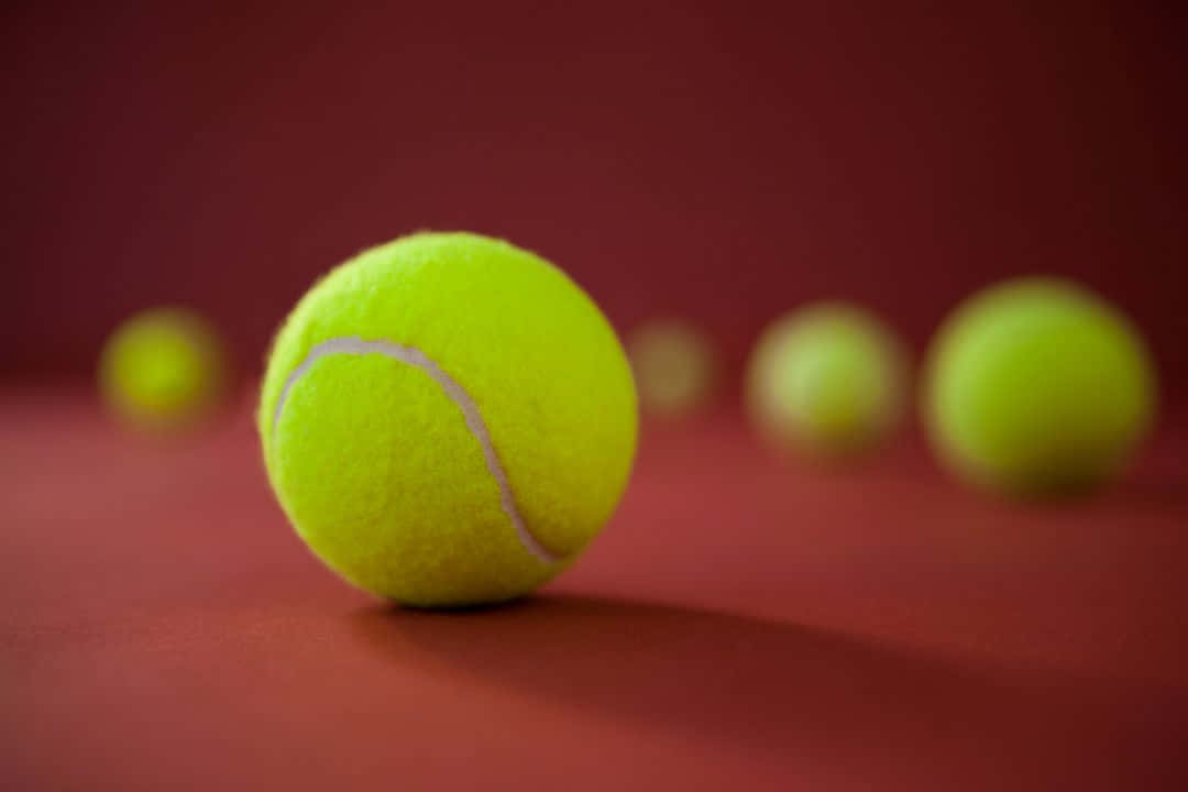 "Hit It Out of the Park with this Tennis Ball" Wallpaper