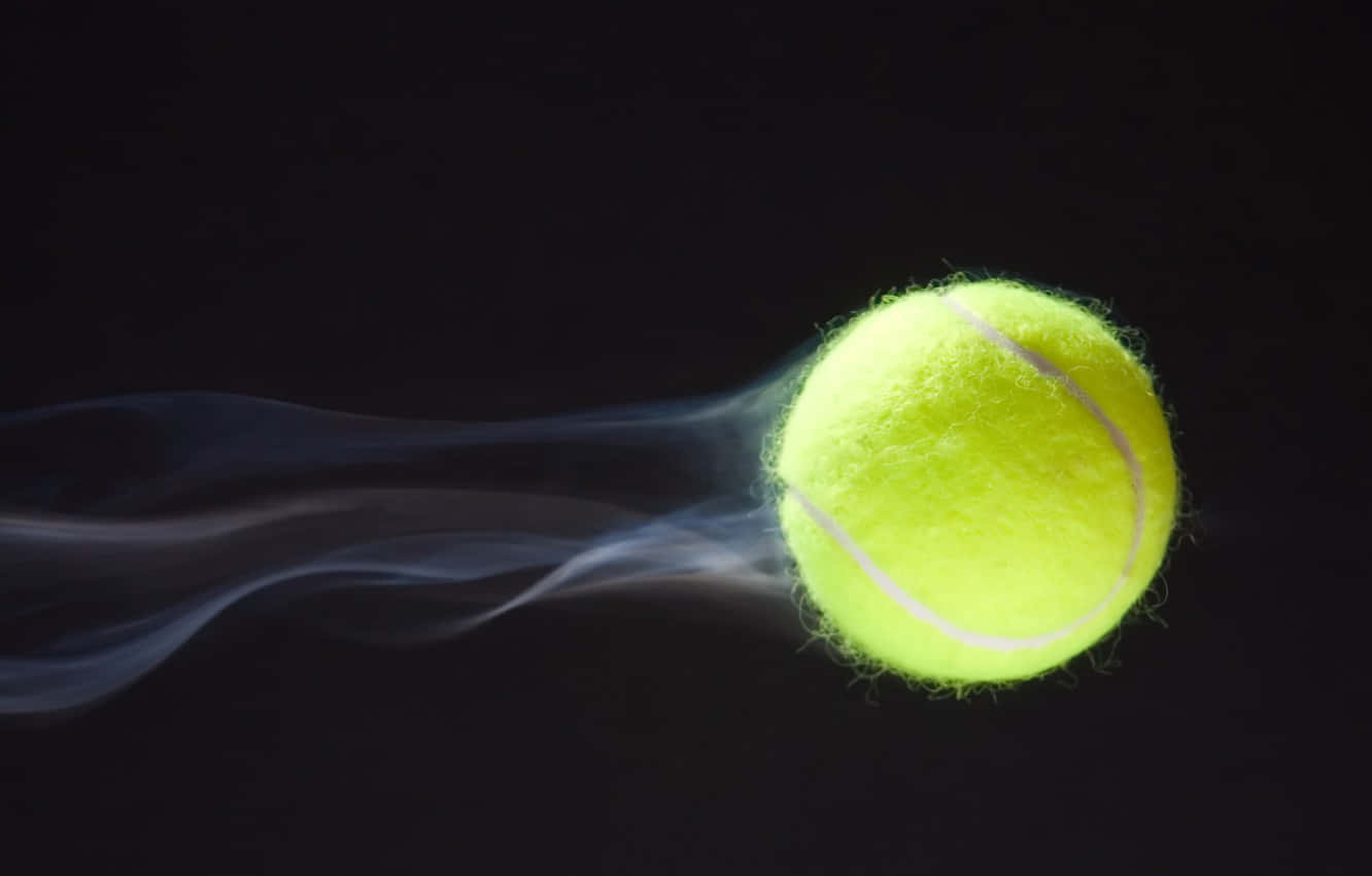 A Tennis Ball Is Flying Out Of The Air Wallpaper