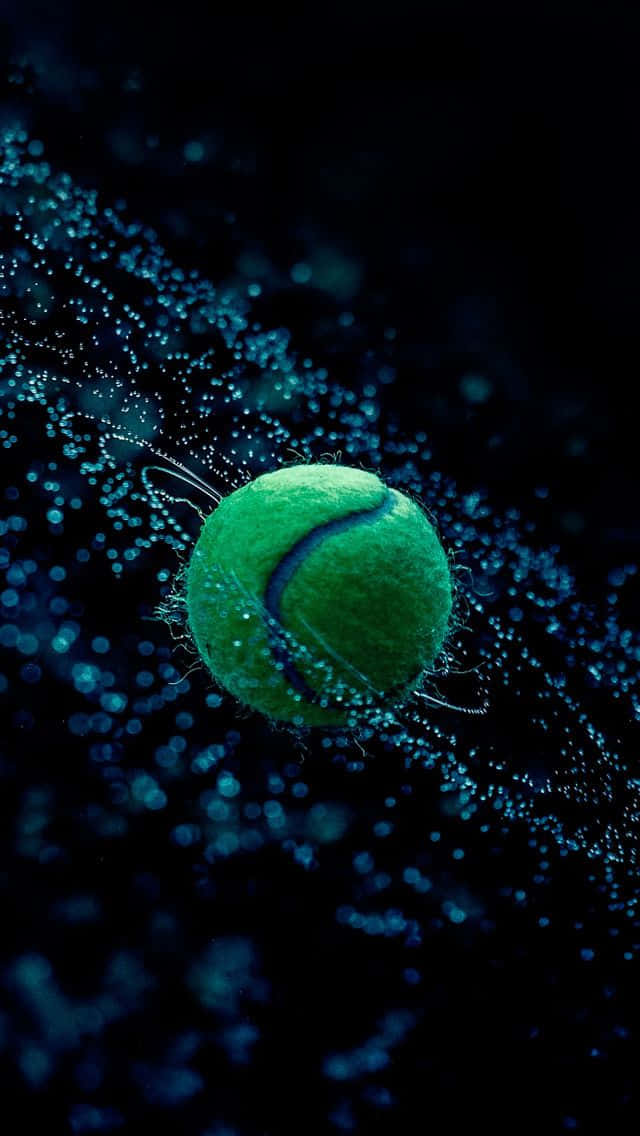 A Tennis Ball Floating In A Dark Background Wallpaper