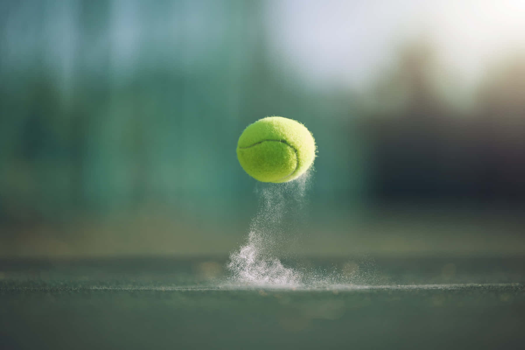 A Tennis Ball Is Flying In The Air Wallpaper