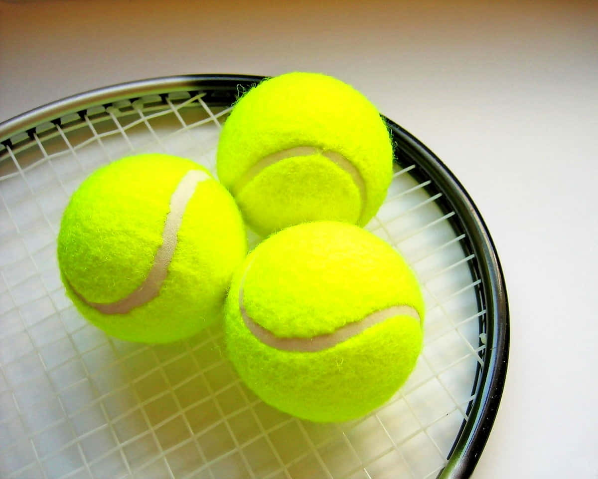 Tennis Ballsand Racket Closeup Wallpaper