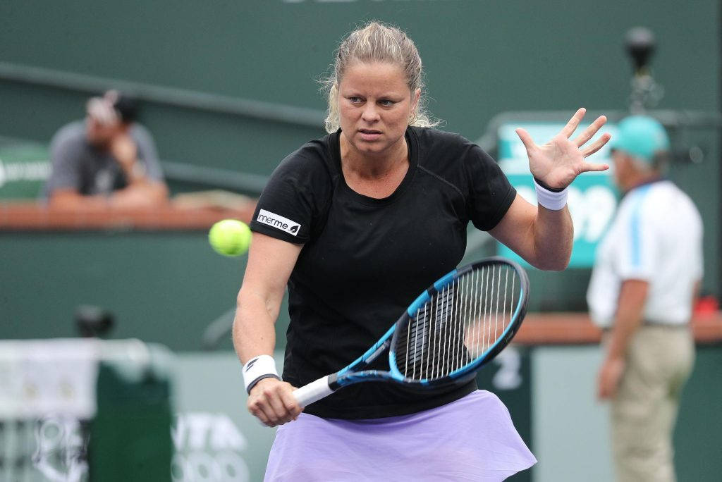 Tennis Champion Kim Clijsters in Action Wallpaper