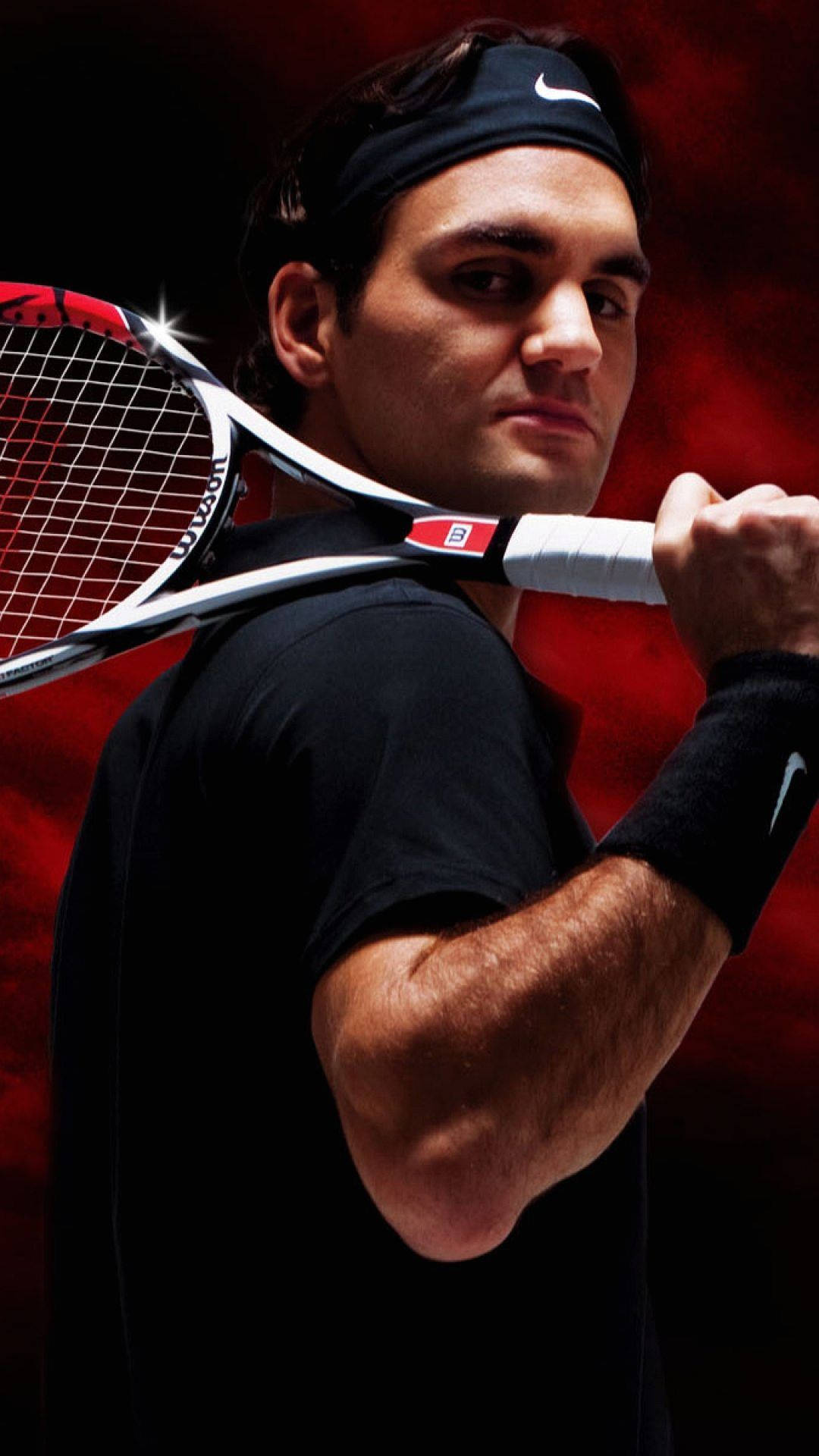 A Man Holding A Tennis Racket Wallpaper