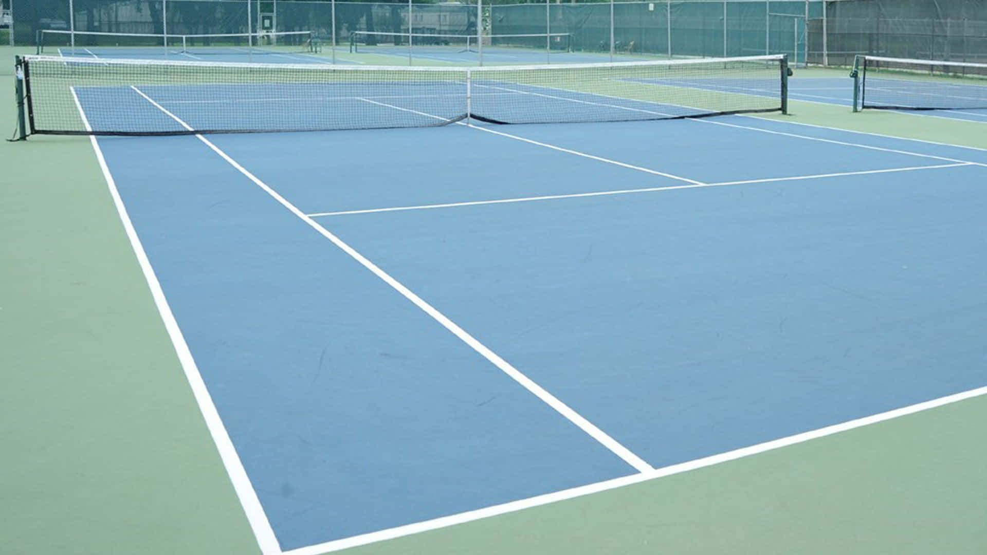 A Tennis Court With Blue Lines And White Lines