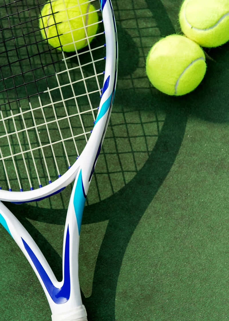 Tennis Racketand Ballson Court Wallpaper