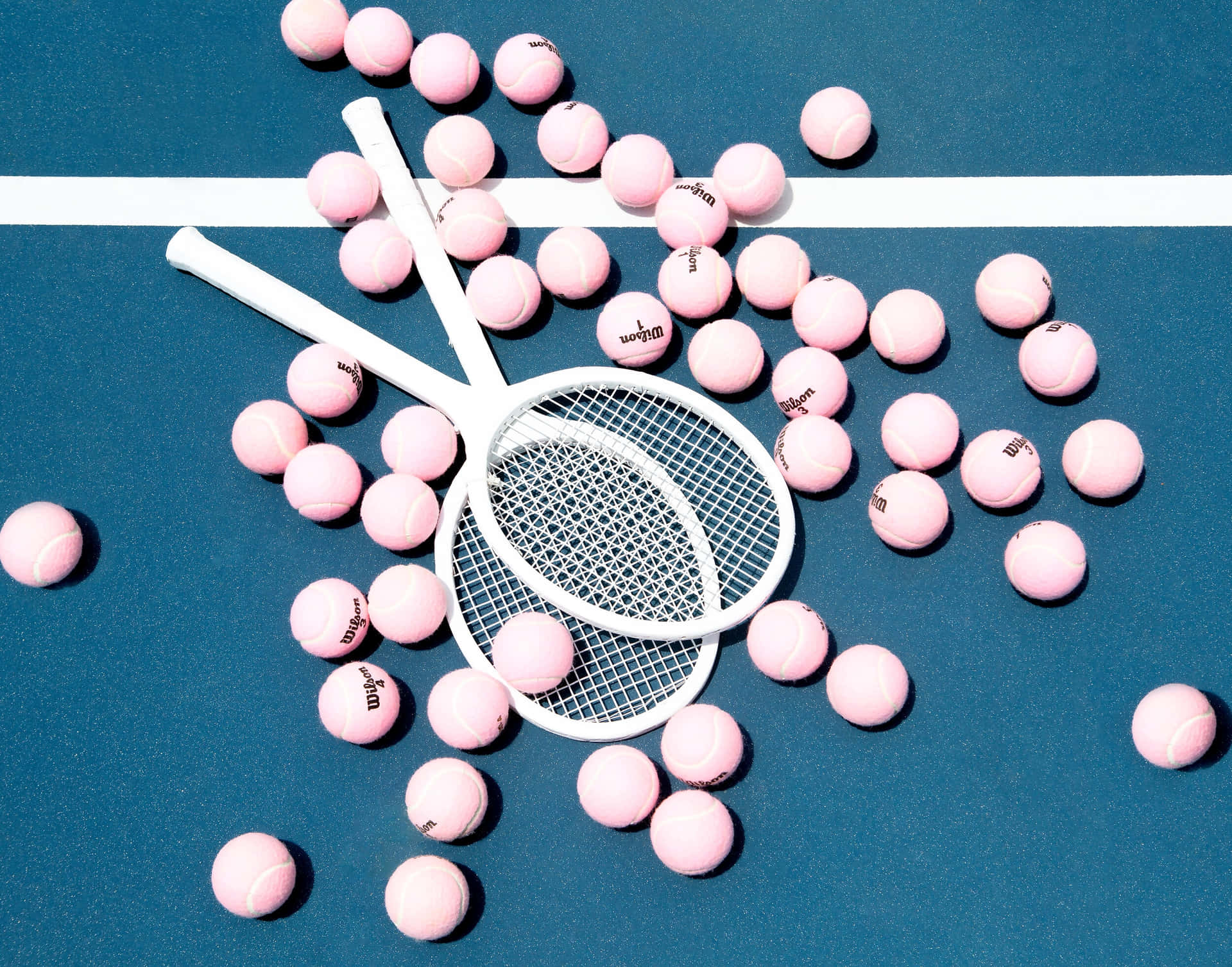 Tennis Racketand Pink Balls Artistic Composition Wallpaper