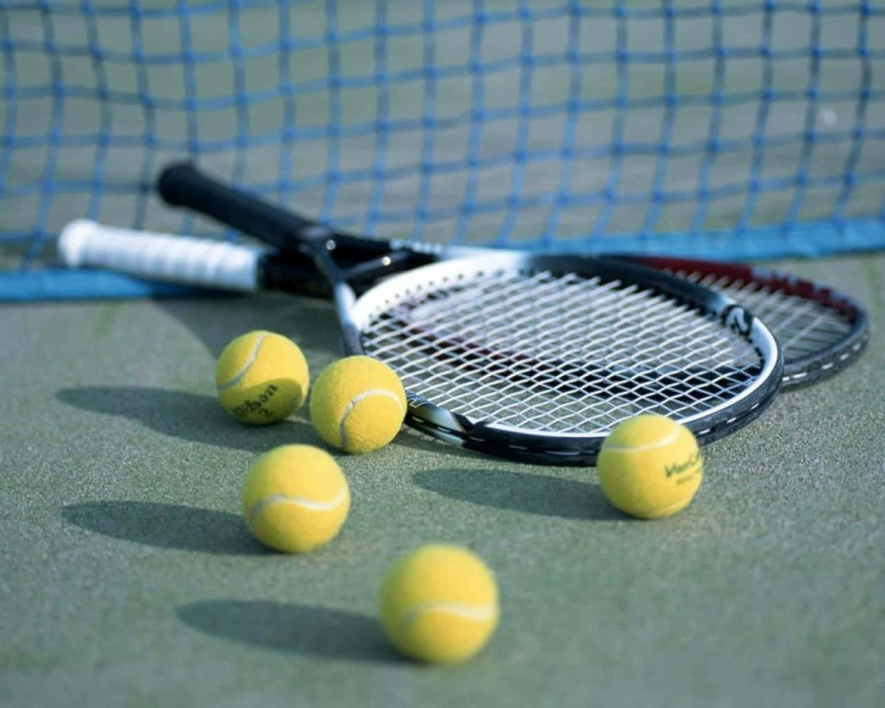 Tennis Racquetand Ballson Court Wallpaper