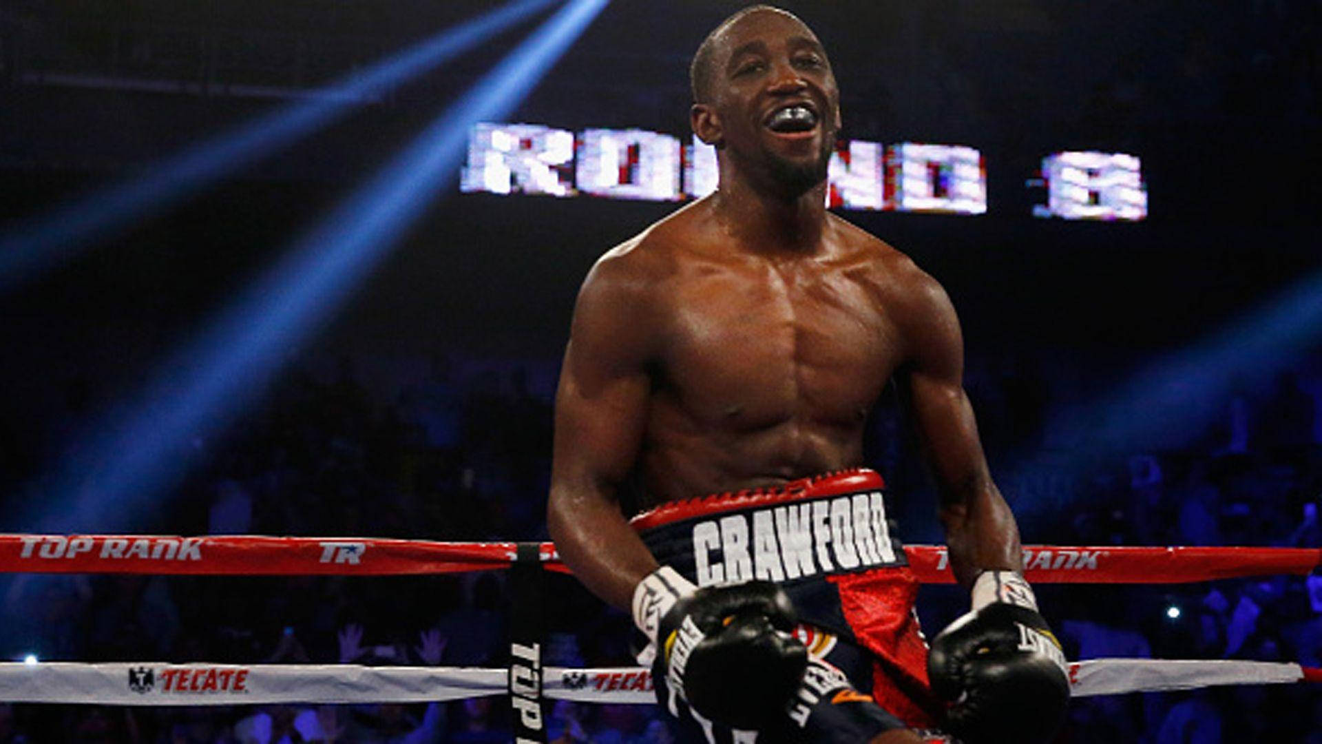 Terence Crawford lands a powerful punch during Round 8 Wallpaper