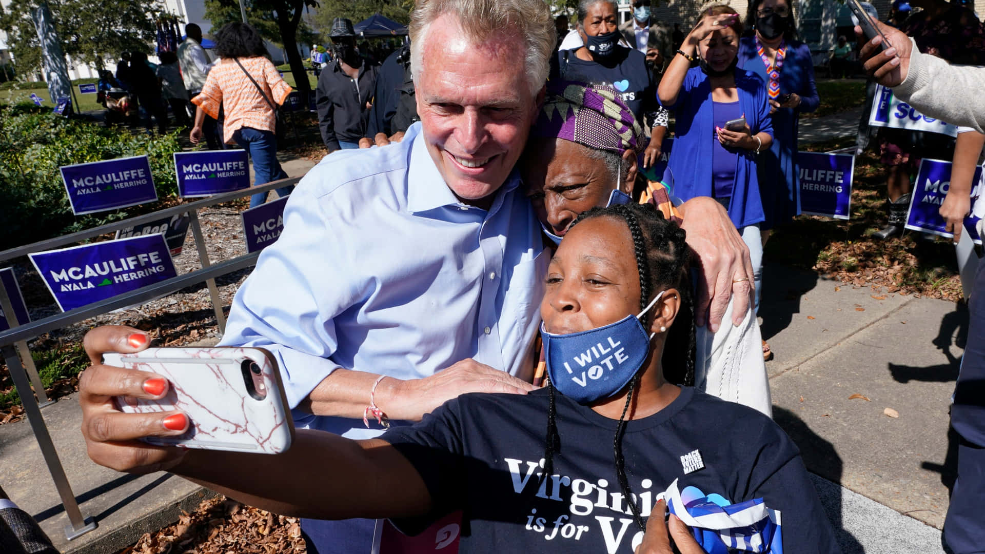 Terry McAuliffe Captures a Selfie Moment with Supporters Wallpaper