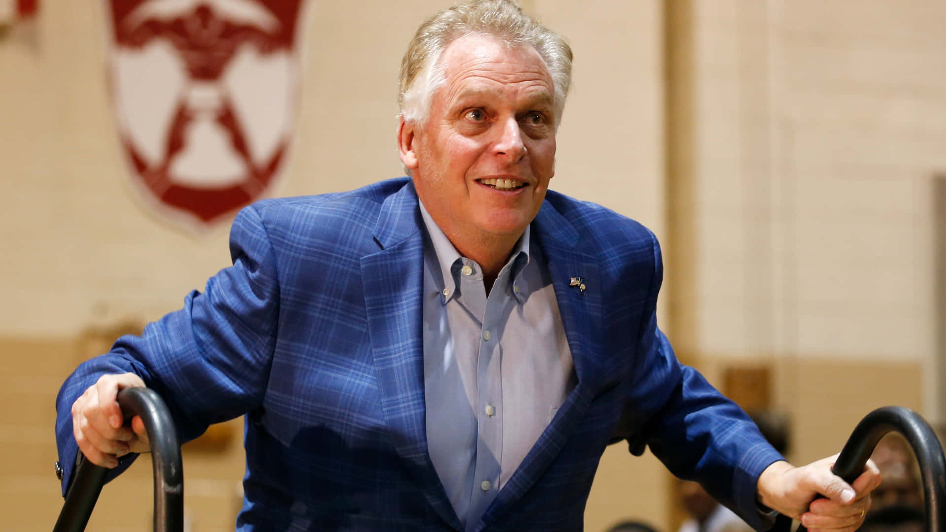 Terry McAuliffe Walking Up To A Stage Wallpaper