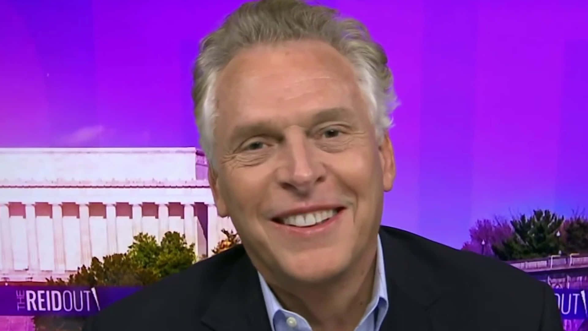 Terry Mcauliffe With A Purple Background Wallpaper