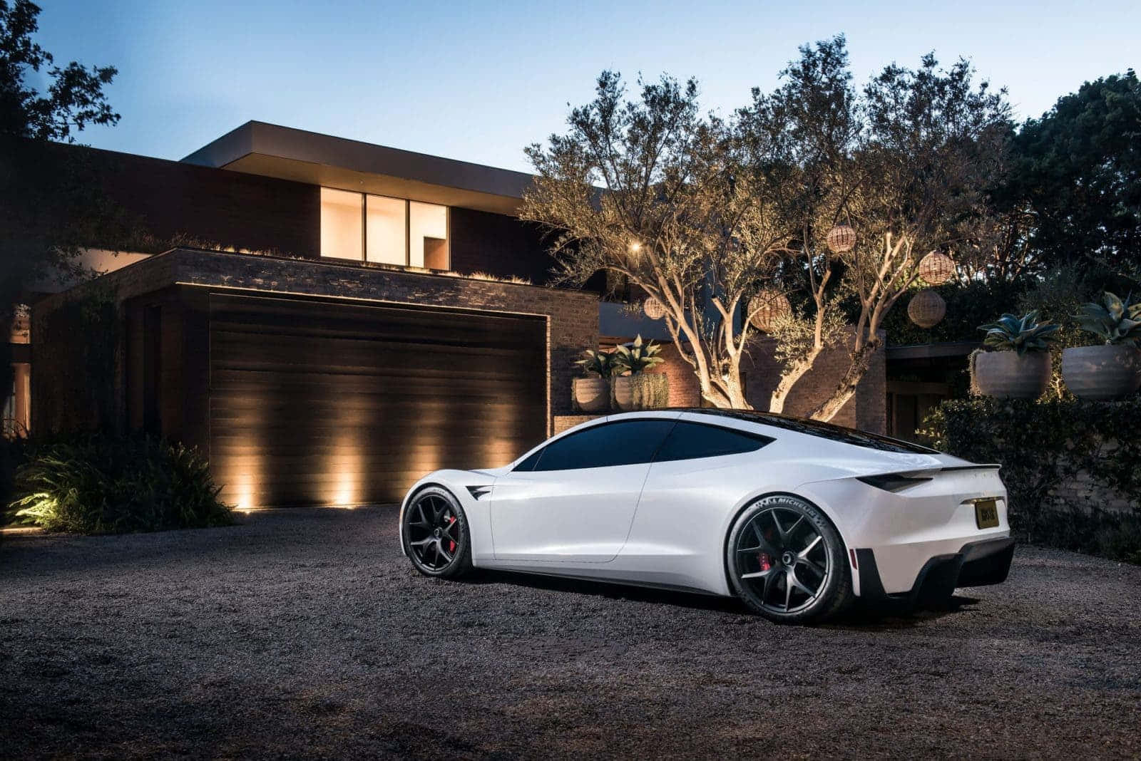 Tesla Car in Motion Under Night Sky