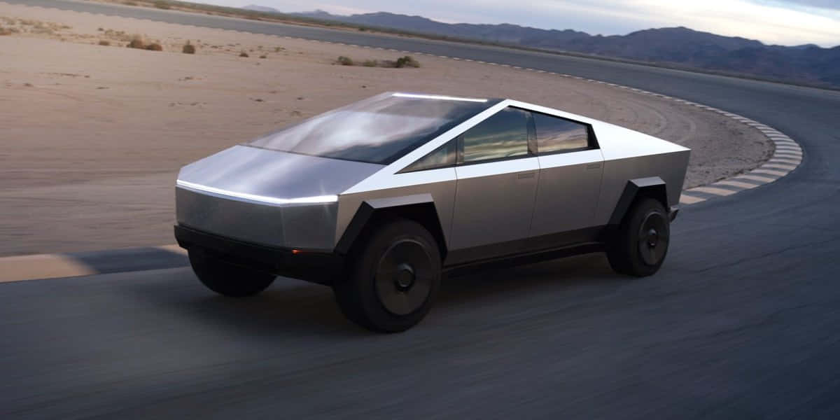 Et fremtidigt køretøj, der kører ned ad en ørkenvej Wallpaper