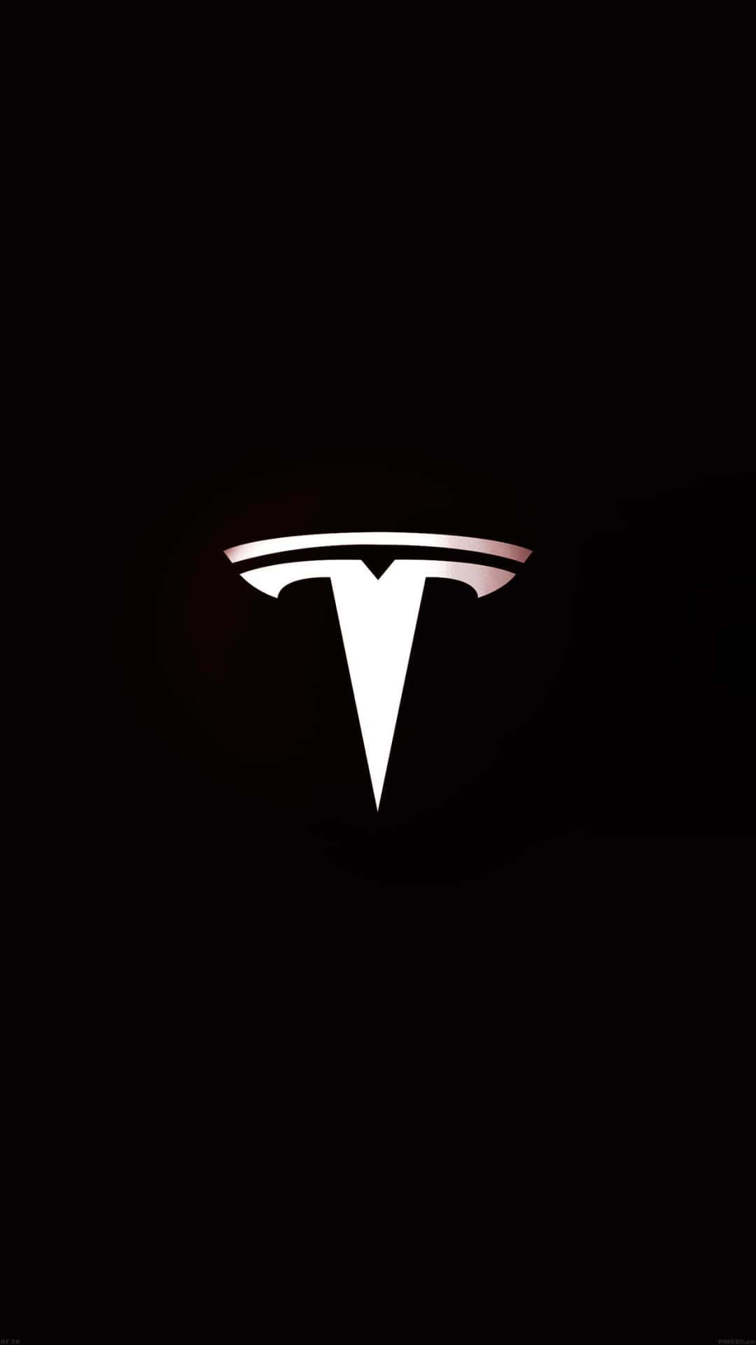 Lys Tesla Logo mod en mørk baggrund Wallpaper