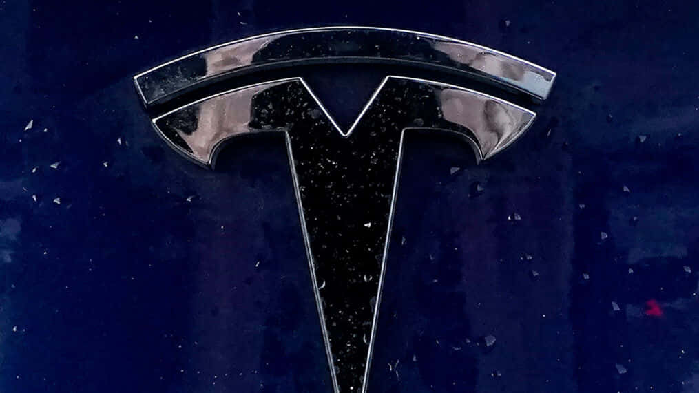 Tesla Logo - an iconic symbol of innovation. Wallpaper